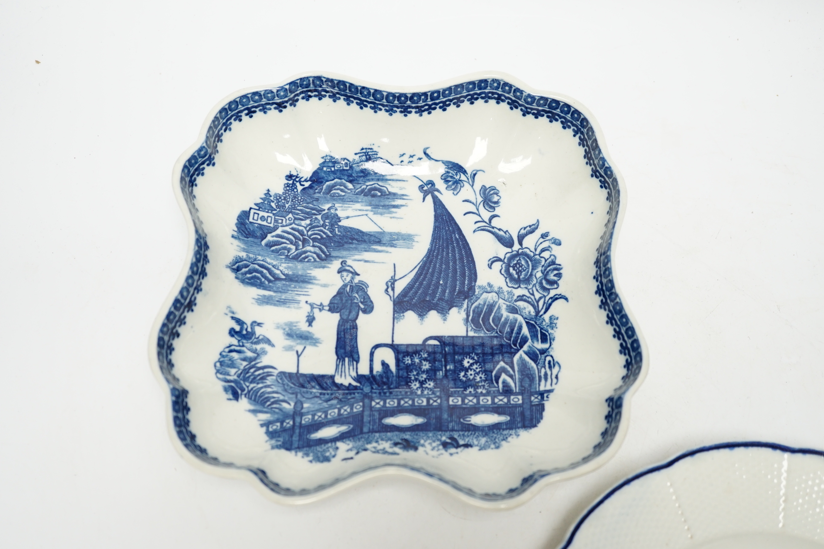 A Caughley carnation pattern plate, c.1765-70 and a fisherman pattern dessert dish c.1780, plate 21.5cm